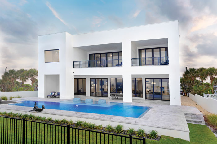 Exterior of a modern home on New Smyrna Beach by Charles Clayton Construction.